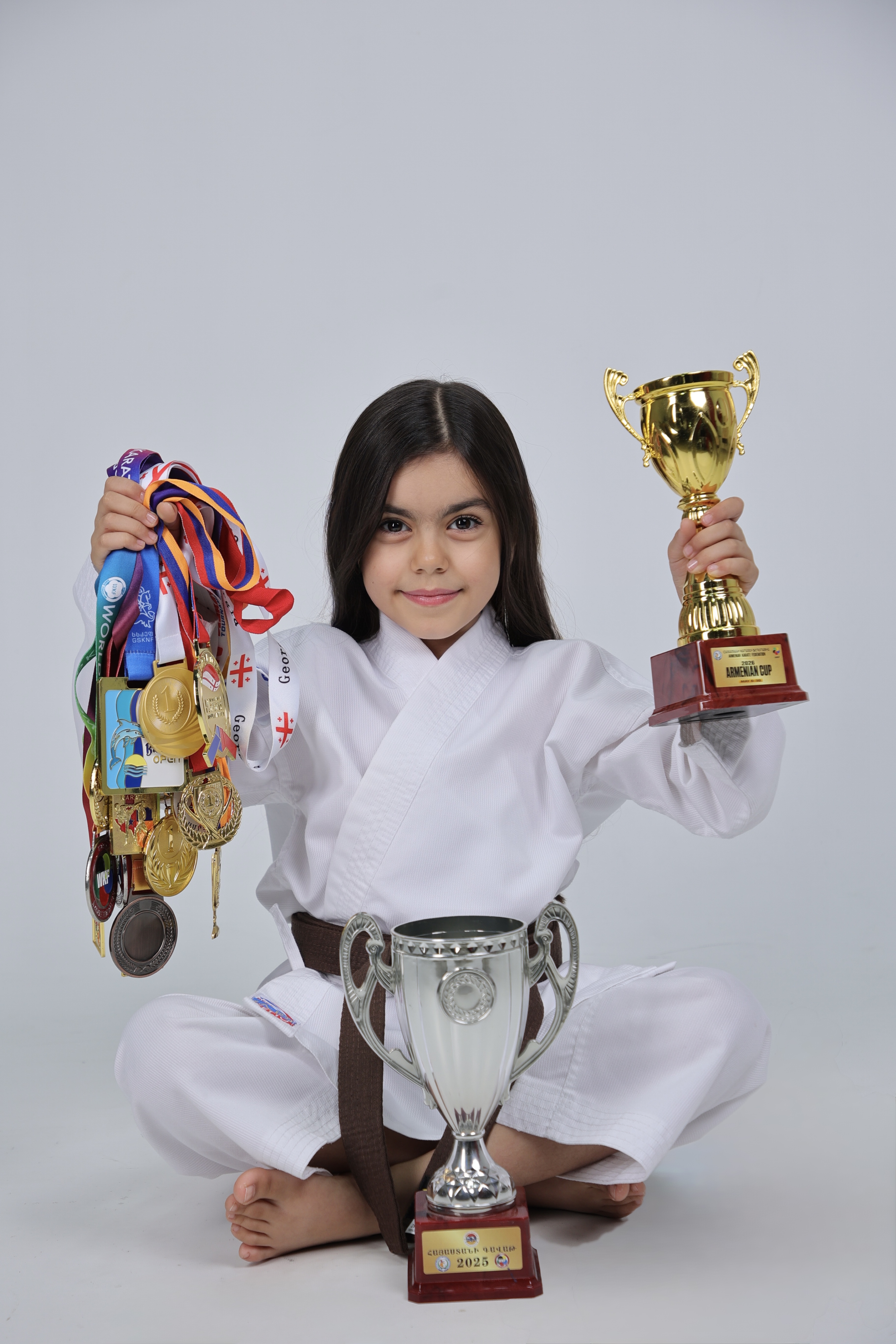 Maria Varzhapetyan with her championship medals and trophies